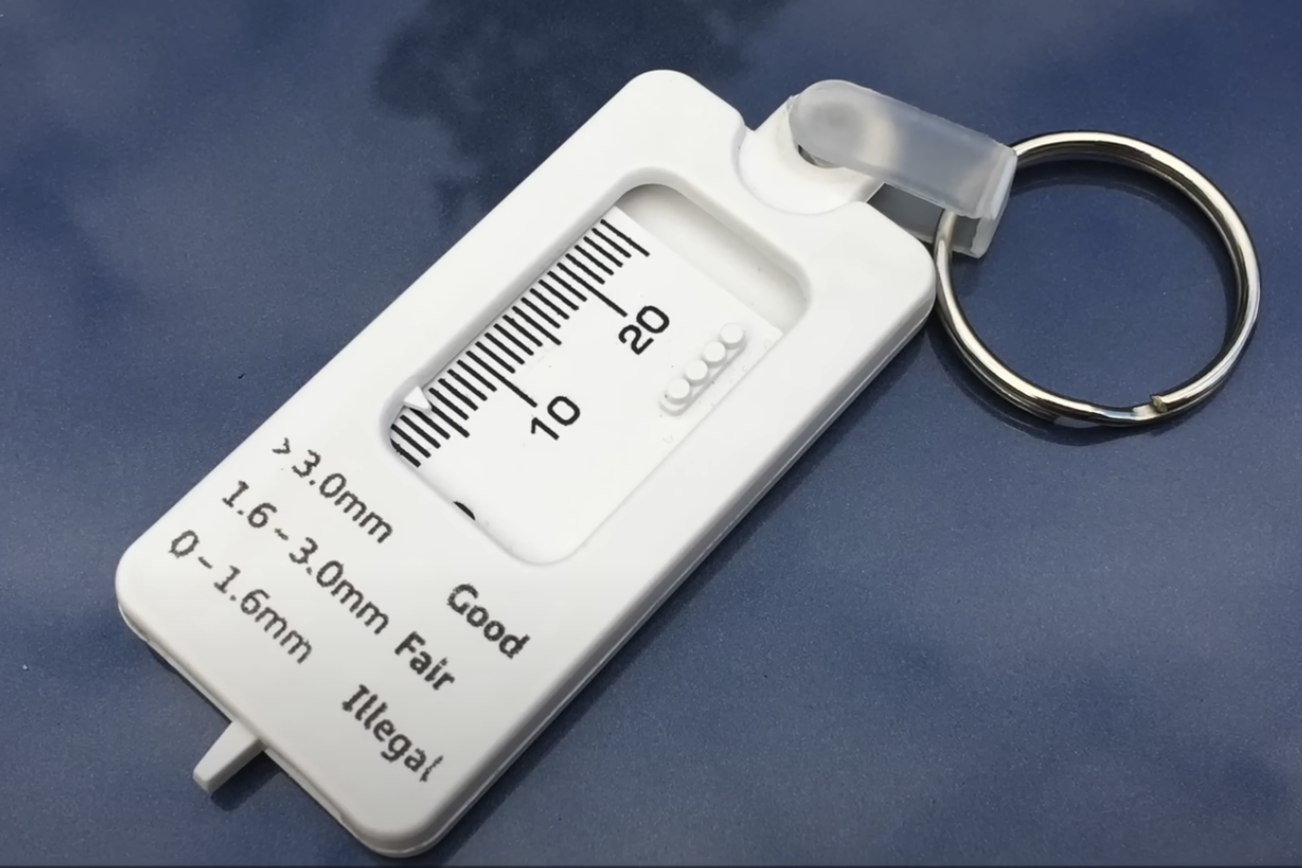 Tread depth gauge in use